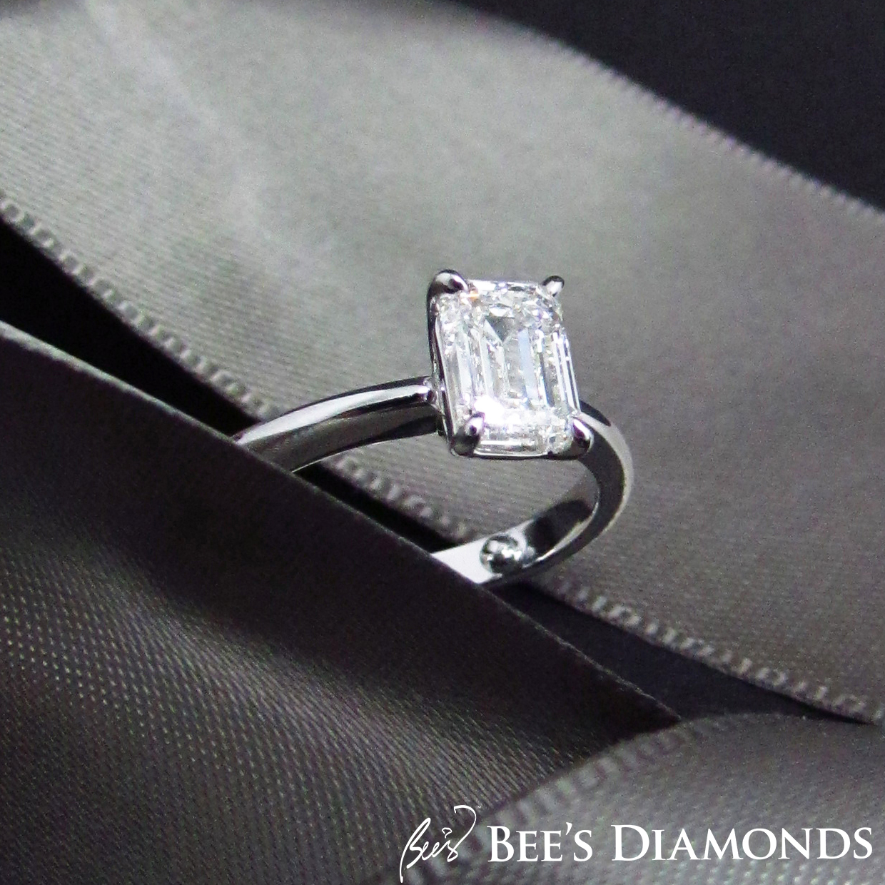 Emerald cut, simple elegant solitaire diamond engagement ring