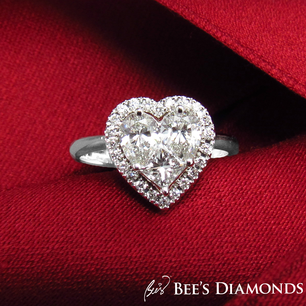 Invisible setting, heart shaped diamond ring with halo