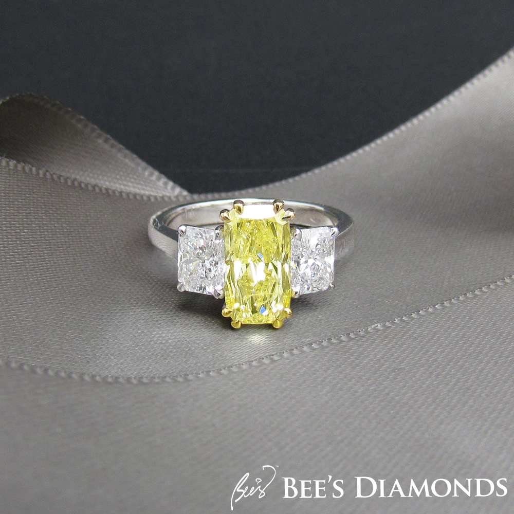 Long radiant cut, fancy yellow three stones diamond ring | tappered baguettes