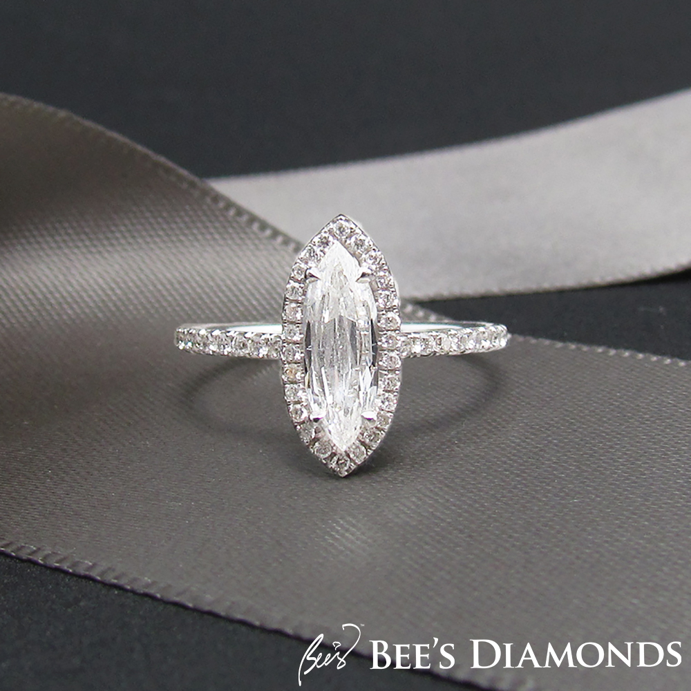 Marquise shape diamond engagement ring | Halo of small diamonds
