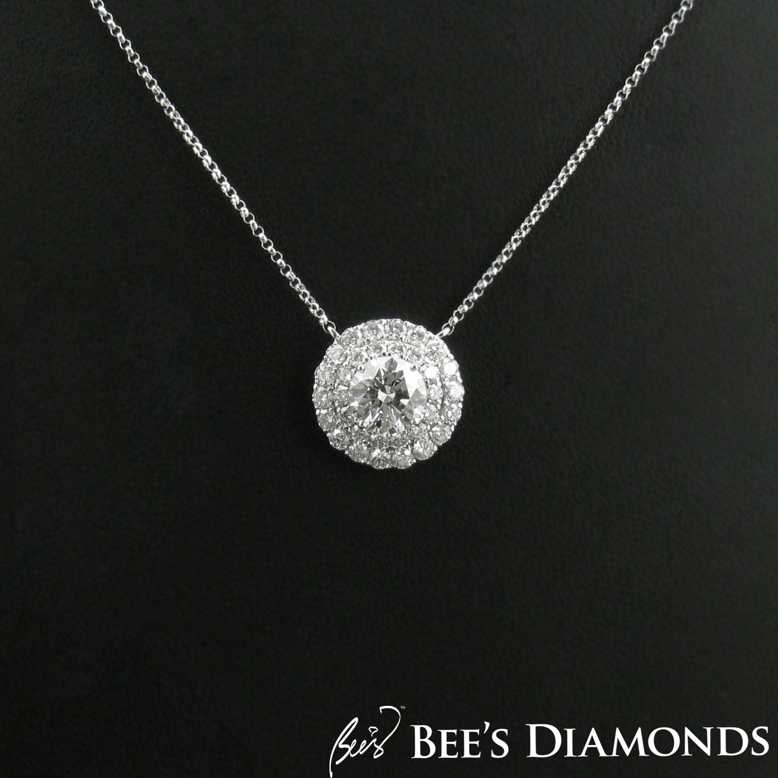 Solitaire diamond pendant with two halos, GIA diamond